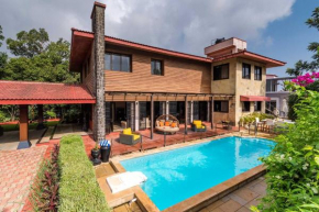 StayVista's Woodstone Villa - Mountain Retreat with Heated Pool & Activities
